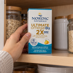 Nordic Naturals Ultimate Omega-D3 2X Mini carton being retrieved from a kitchen cupboard