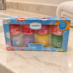 AI-generated lifestyle scene of the NORO eight-pot lip balm set in its retail box; props not included.