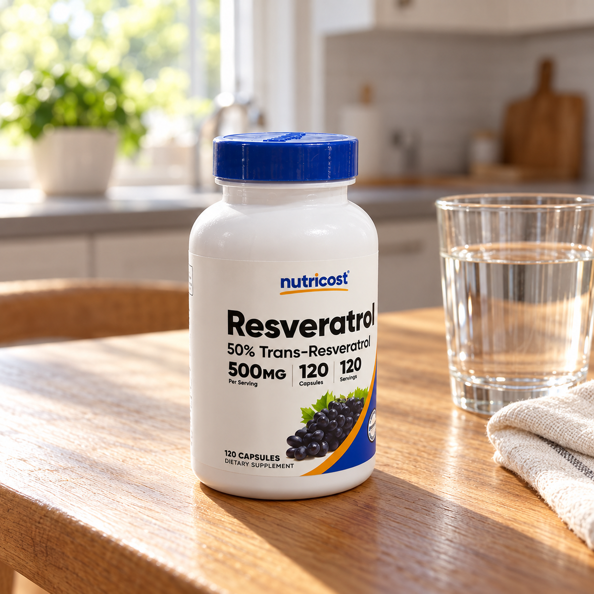 Nutricost Resveratrol 500 mg 120-capsule bottle on an oak table beside water and linen.