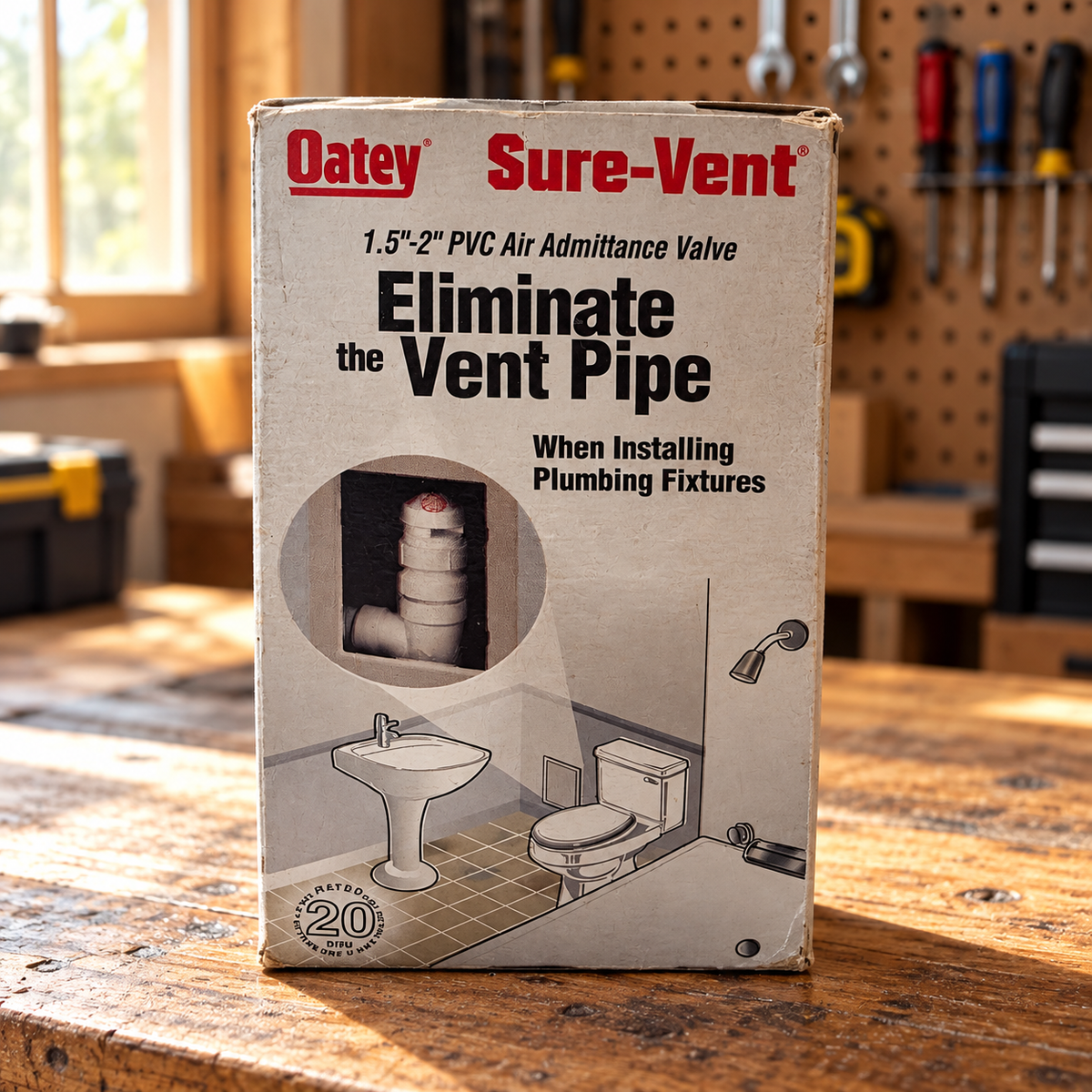 AI-styled illustrative workshop scene with Oatey Sure-Vent 39016 retail box; contents not shown