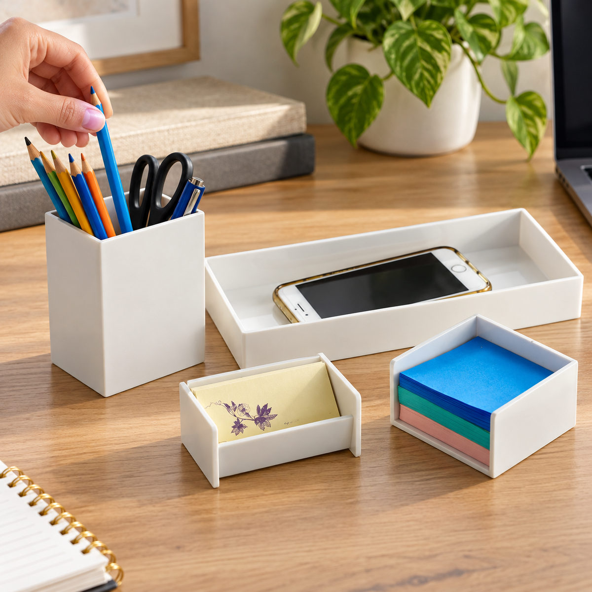 Hand taking a pencil from the white Officemate desk organizer set