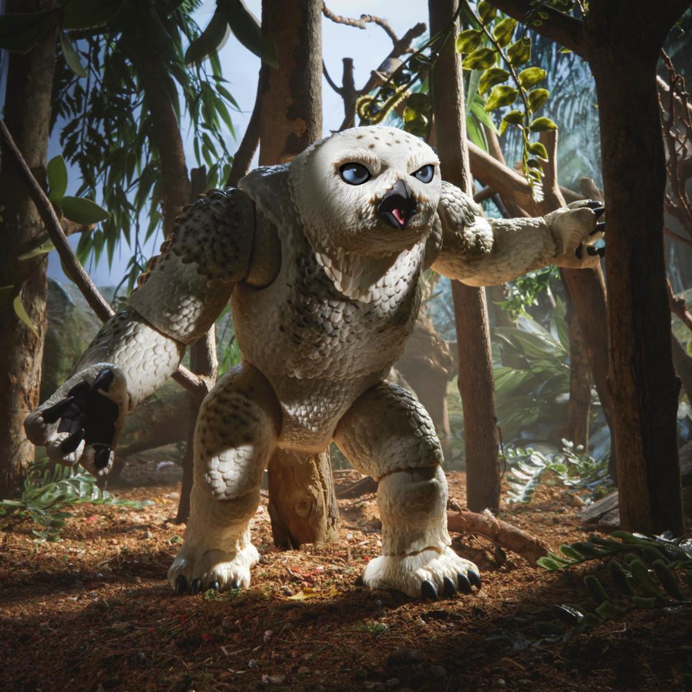 Owlbear/Doric figure posed upright with raised arms in a woodland display.