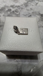 Actual Pandora Passport Travel Dangle Charm on its white box