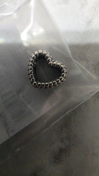 Actual close-up of the Pandora beaded open heart charm