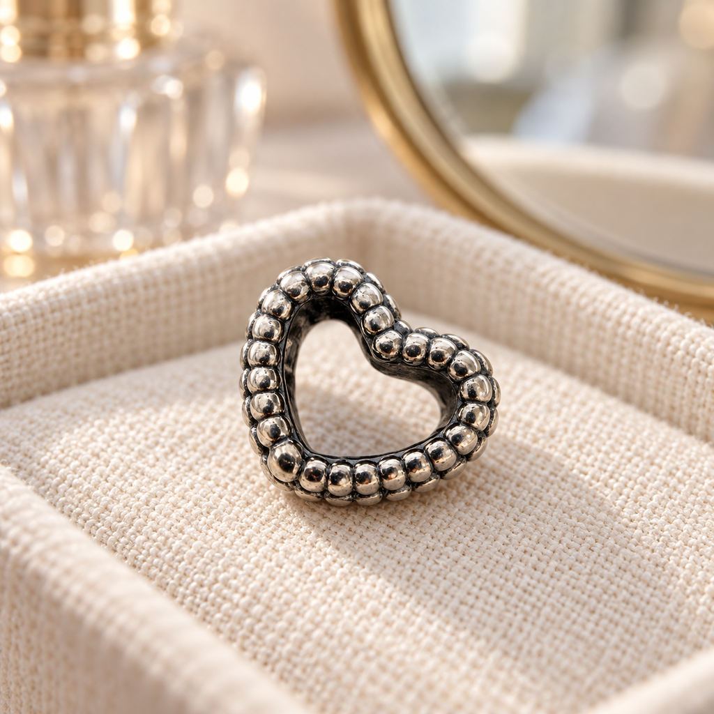 Pandora beaded open heart charm on a linen jewelry mat