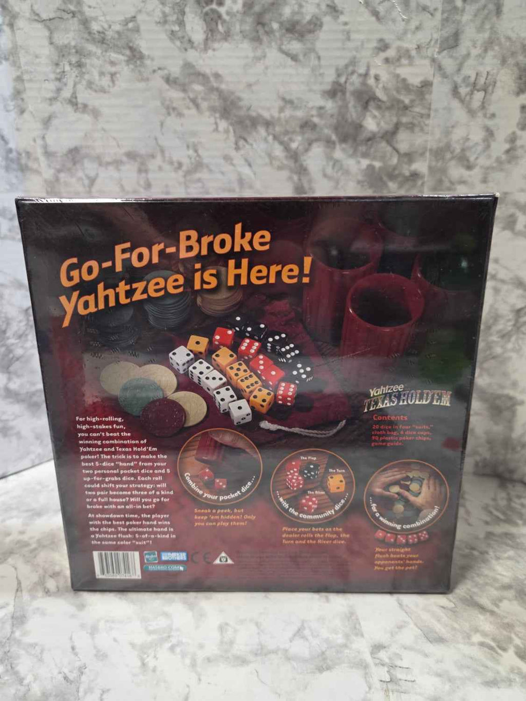 Actual stocked Parker Brothers Yahtzee Texas Hold'em dice game, item 42641, sealed box back showing contents and gameplay