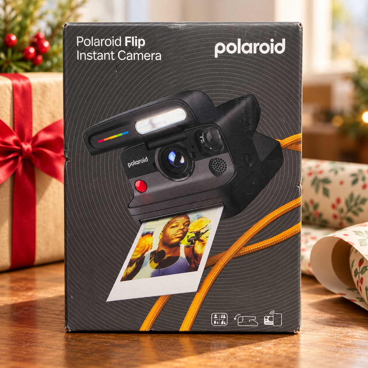 AI-generated lifestyle scene of one closed Polaroid Flip black instant camera retail box in a gift table setting. Props not included.
