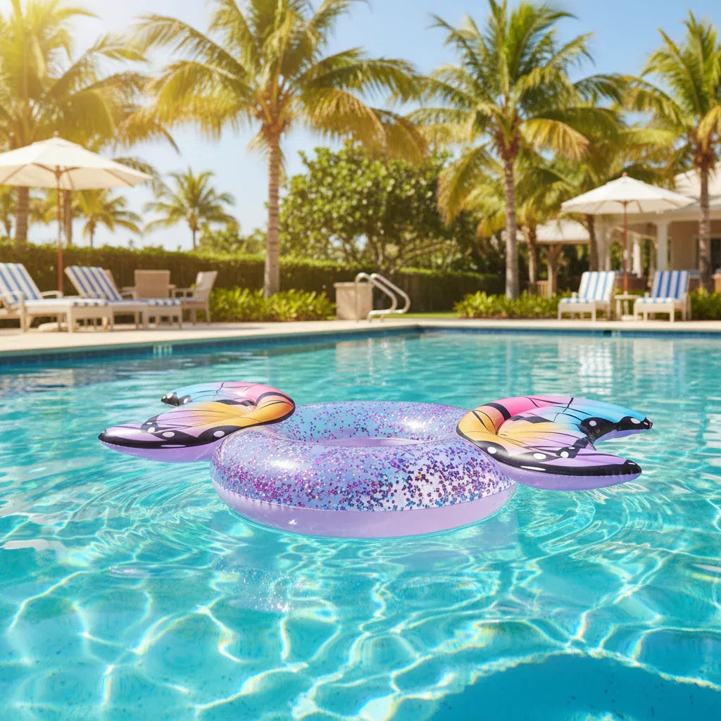 AI-generated lifestyle scene of the PoolCandy Glitter Butterfly 40-inch pool tube floating in a pool. Background props not included.