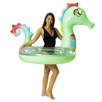 Adult holding the PoolCandy Glitter Seahorse pool tube to show its size