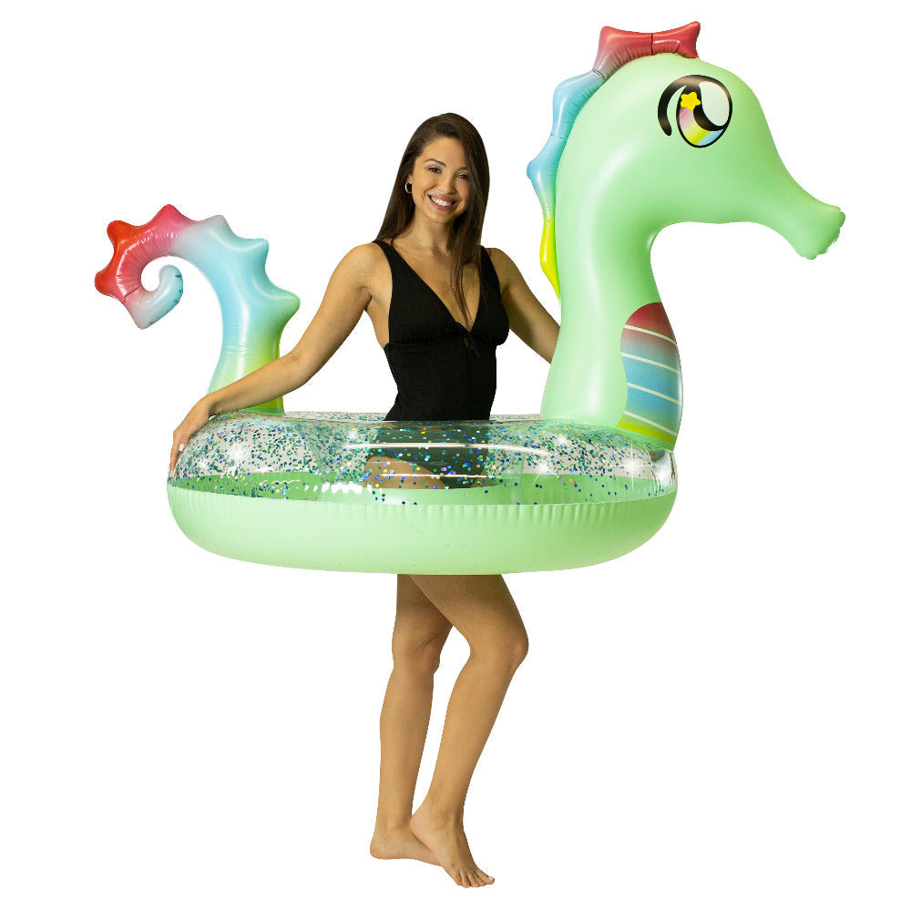 Adult holding the PoolCandy Glitter Seahorse pool tube to show its size