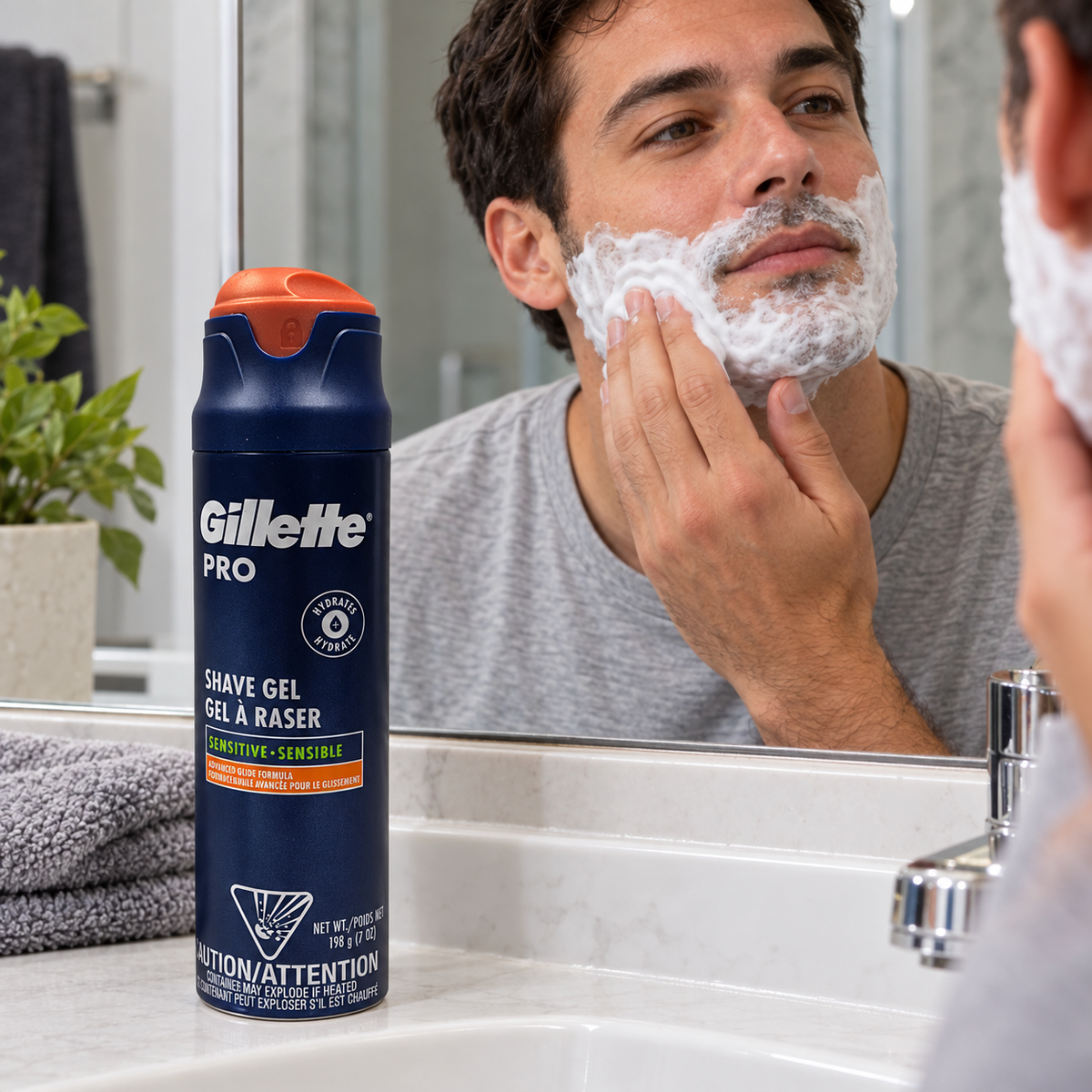 Applying shaving lather with the PRO Sensitive can beside the sink