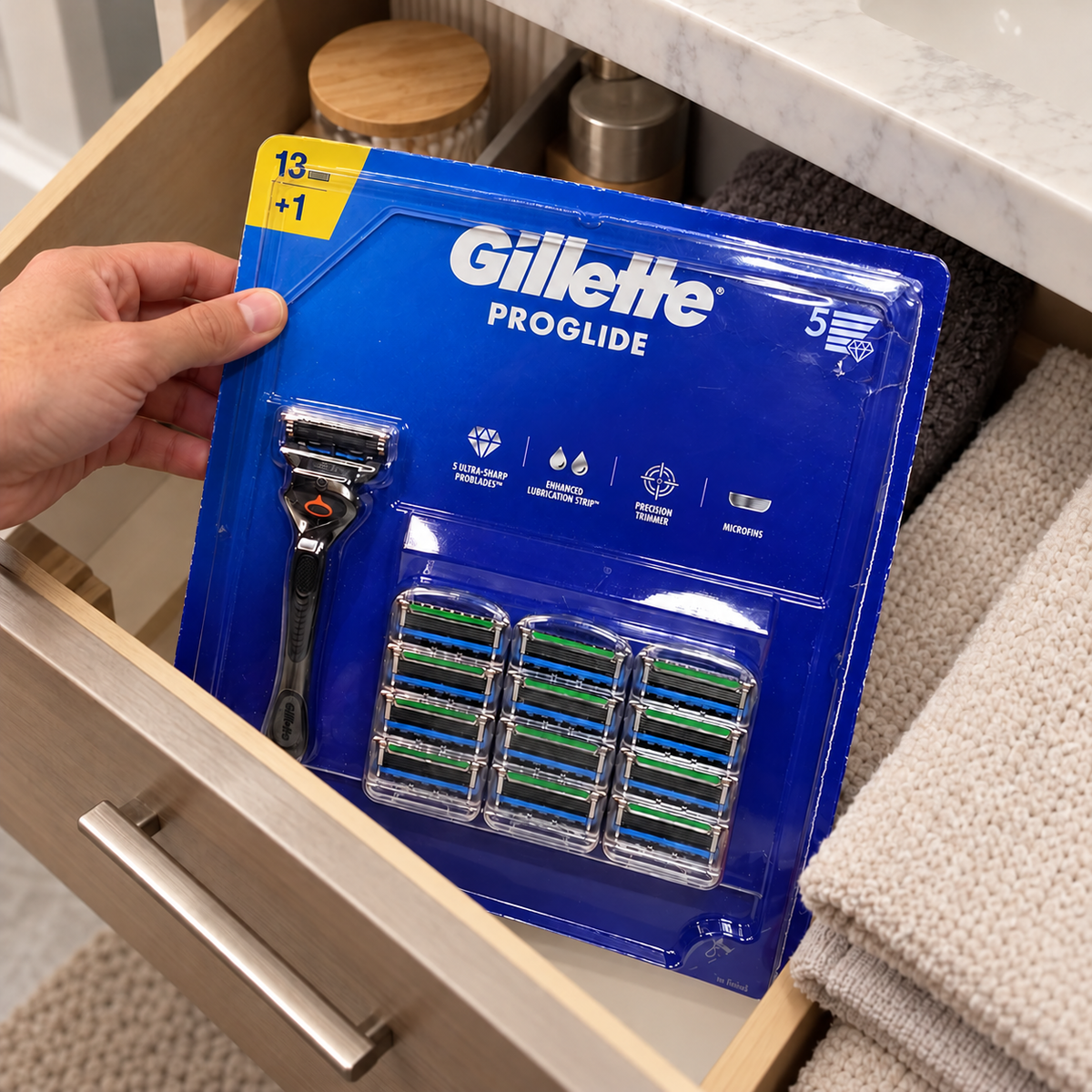 Placing a Gillette ProGlide 13-cartridge value pack in a bathroom drawer