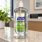 Illustrative setting: PURELL Naturals 1 liter pump bottle at a reception counter; decor not included