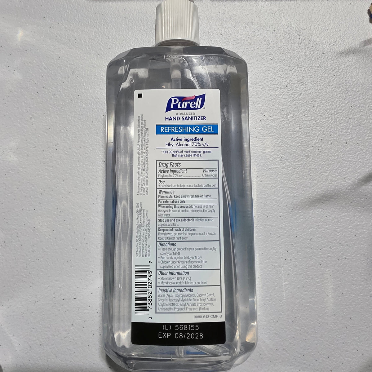 Actual bottle rear label with UPC 073852027457 and August 2028 expiration