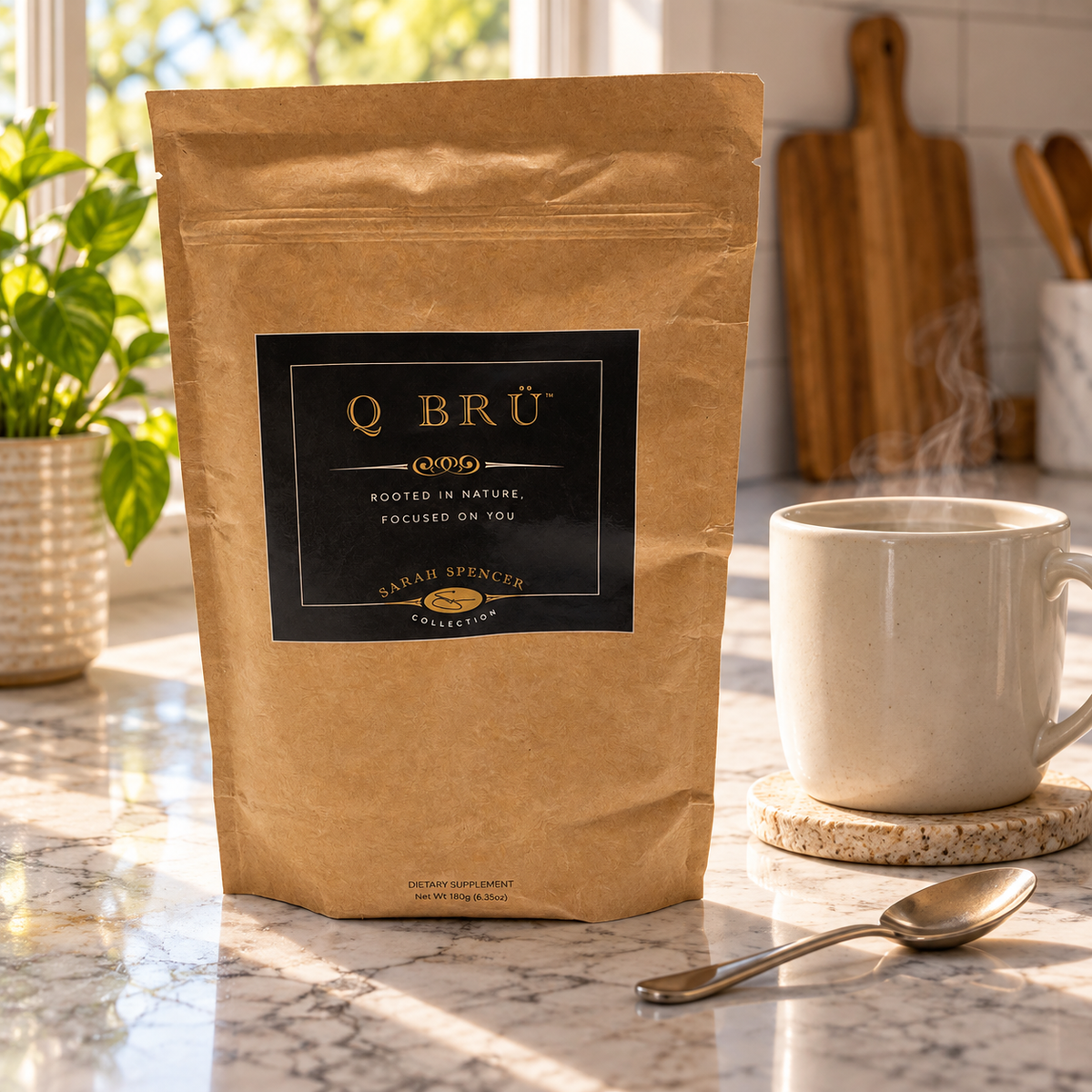 Q BRÜ pouch beside a mug and spoon at a kitchen beverage station