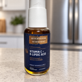 Quicksilver Scientific Vitamin C and R-Lipoic Acid 50 mL bottle in a kitchen setting