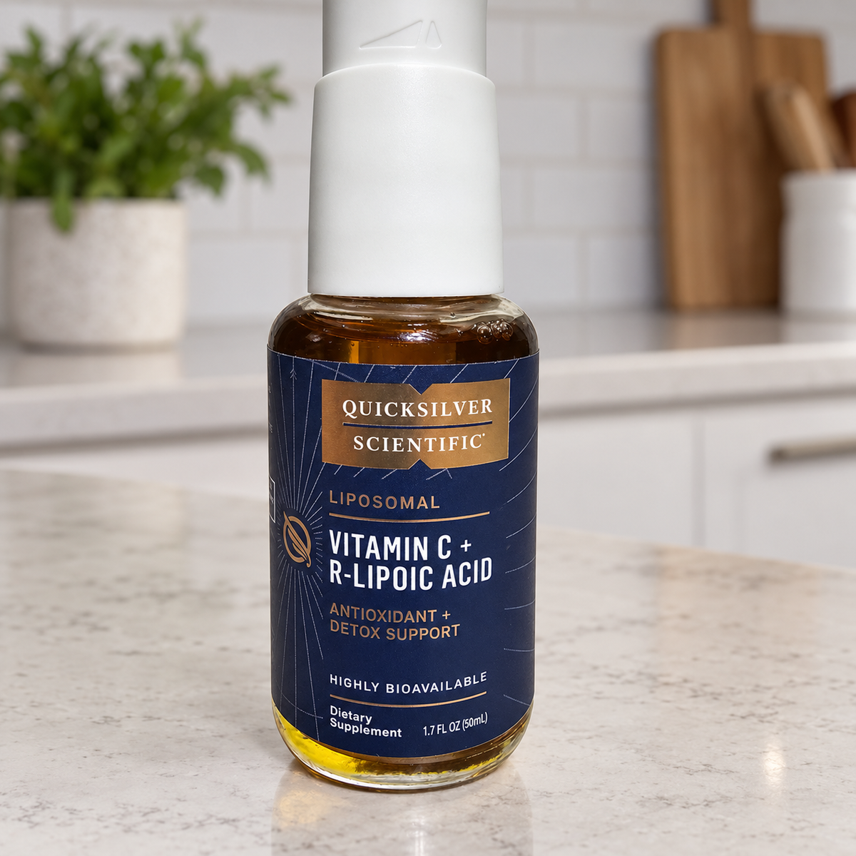 Quicksilver Scientific Vitamin C and R-Lipoic Acid 50 mL bottle in a kitchen setting
