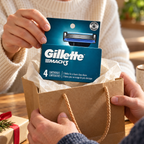 Adult lifting one Gillette Mach3 Original 4-count refill pack from a gift bag.