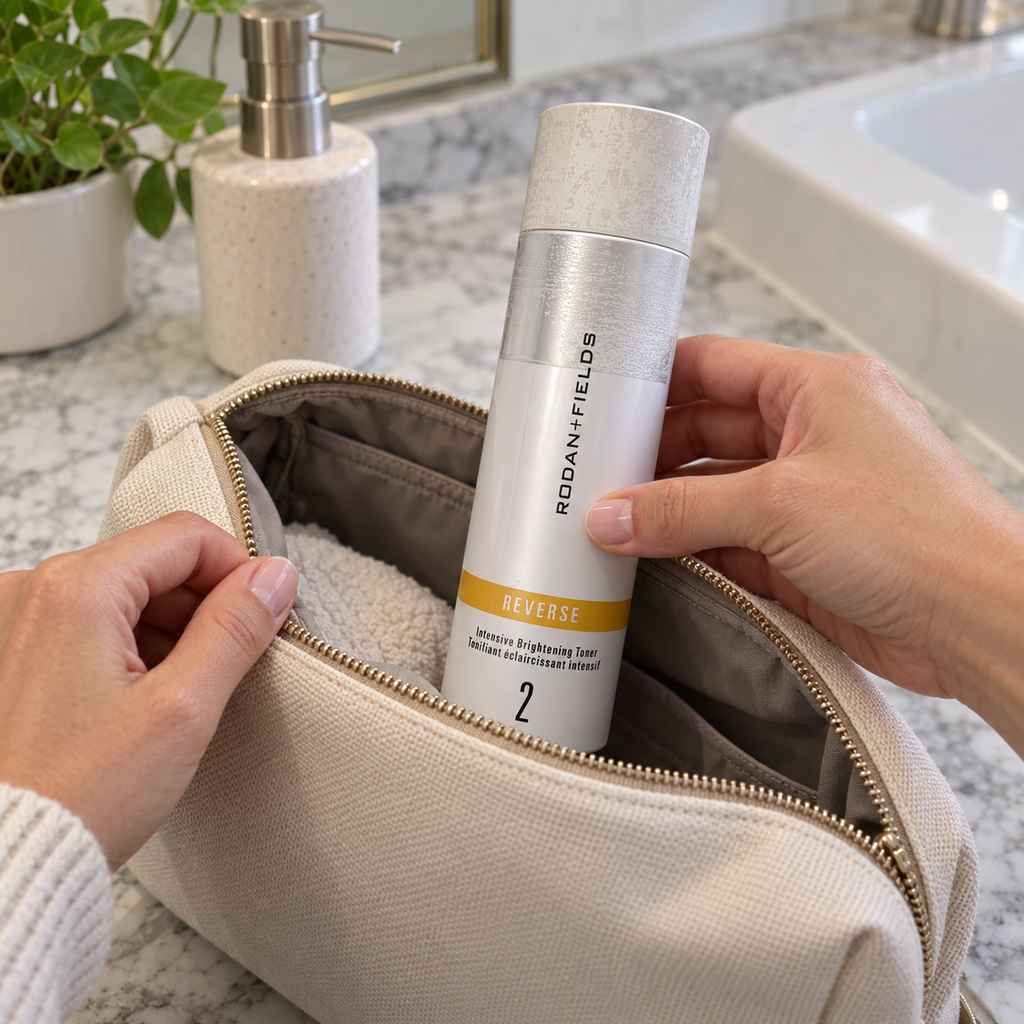 Placing the capped Rodan + Fields REVERSE toner bottle into a toiletry bag