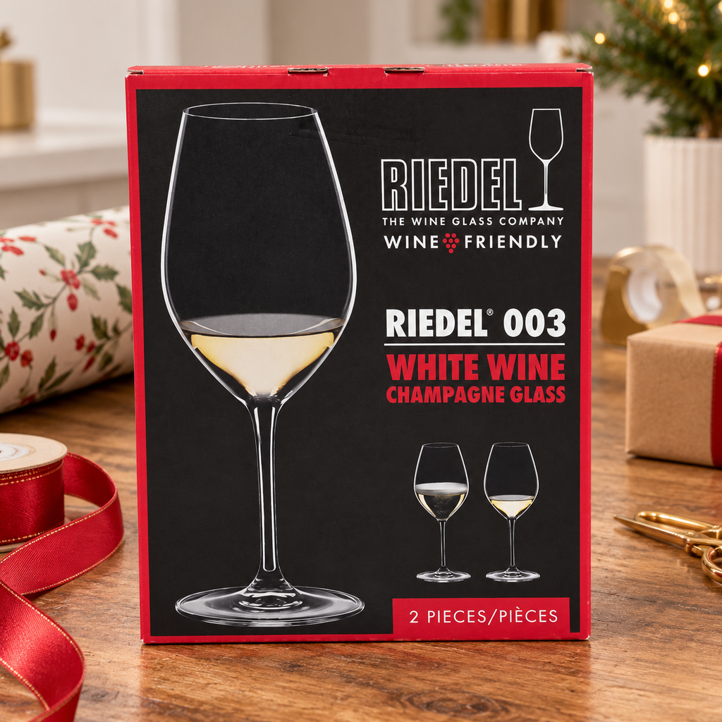 AI-generated lifestyle scene of one closed Riedel 003 White Wine Champagne Glass two-piece box on a gift station. Props not included.