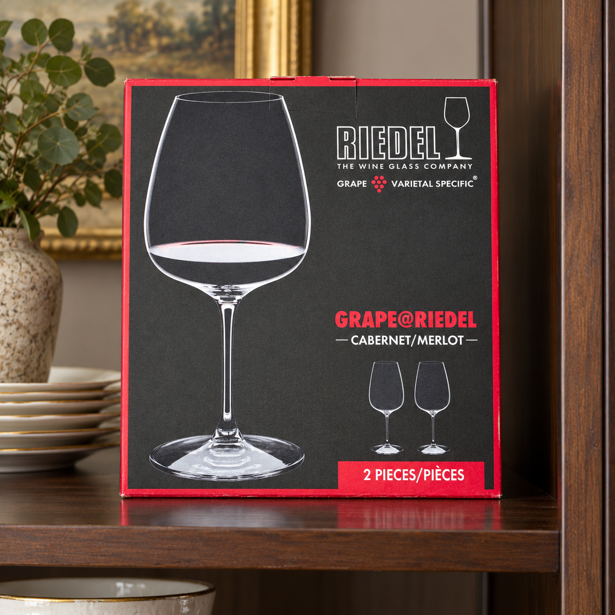 AI-generated lifestyle scene of one closed GRAPE@RIEDEL Cabernet/Merlot two-piece glass box in a cabinet shelf setting. Props not included.