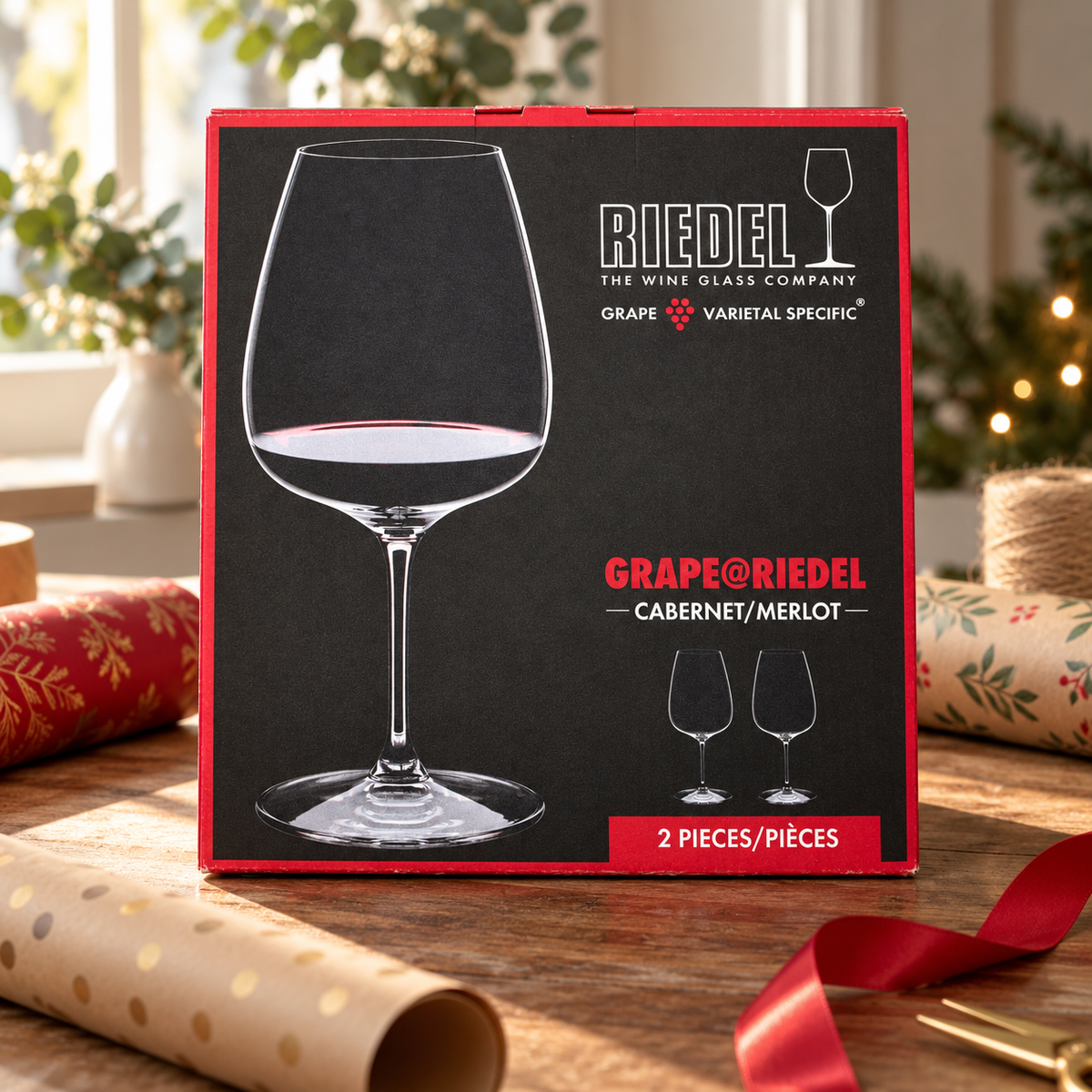 AI-generated lifestyle scene of one closed GRAPE@RIEDEL Cabernet/Merlot two-piece glass box in a gift desk setting. Props not included.