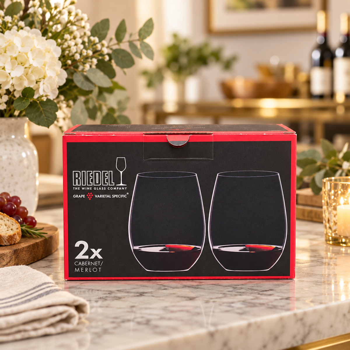 AI-generated lifestyle illustration of one closed RIEDEL O Cabernet/Merlot two-piece box in a housewarming table setting. Background props not included.