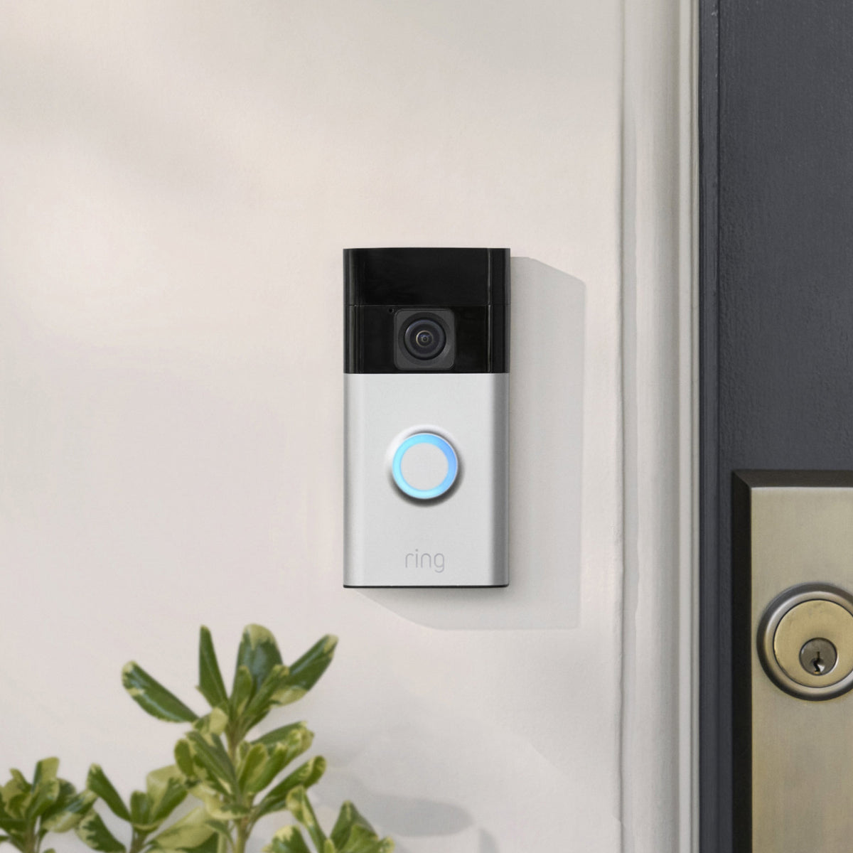 Ring Battery Doorbell (2024) in Satin Nickel mounted beside a front door.