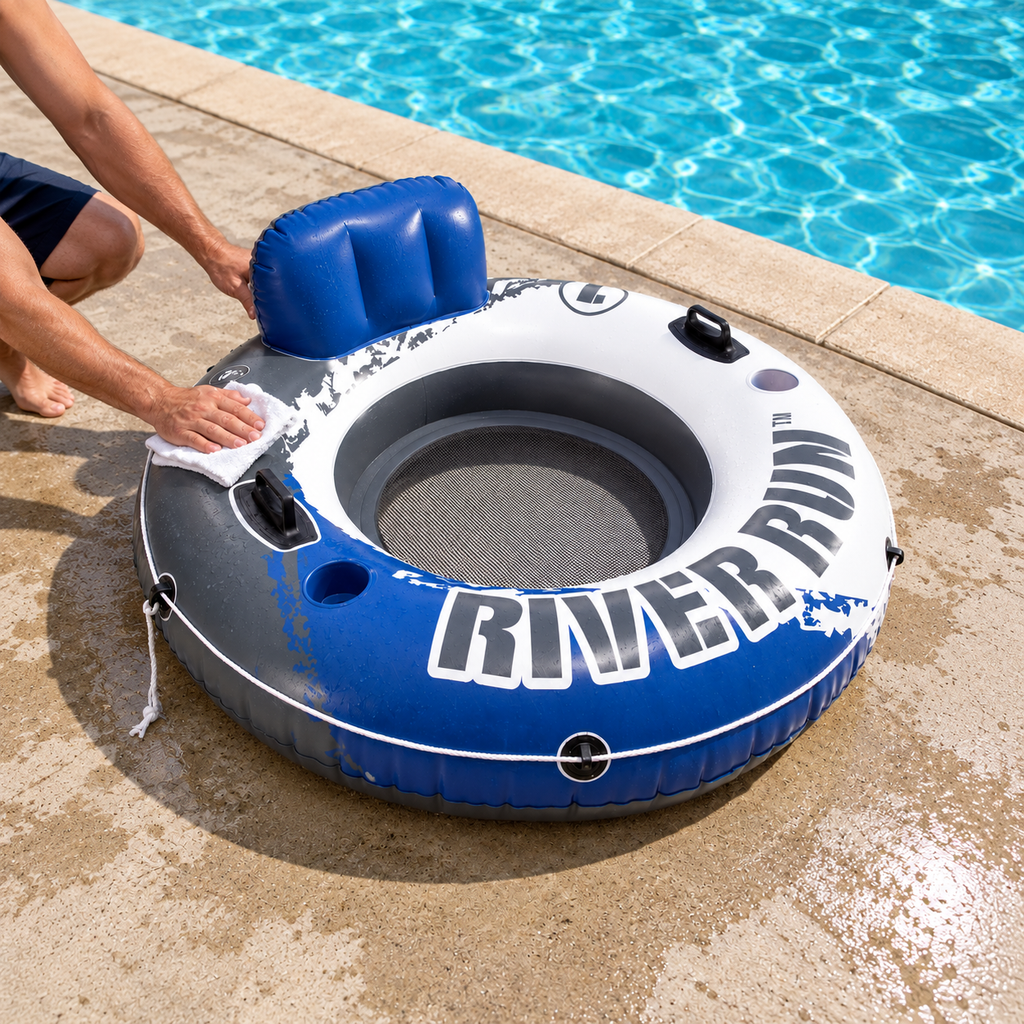 Wiping the gray panel of an Intex River Run tube after a swim