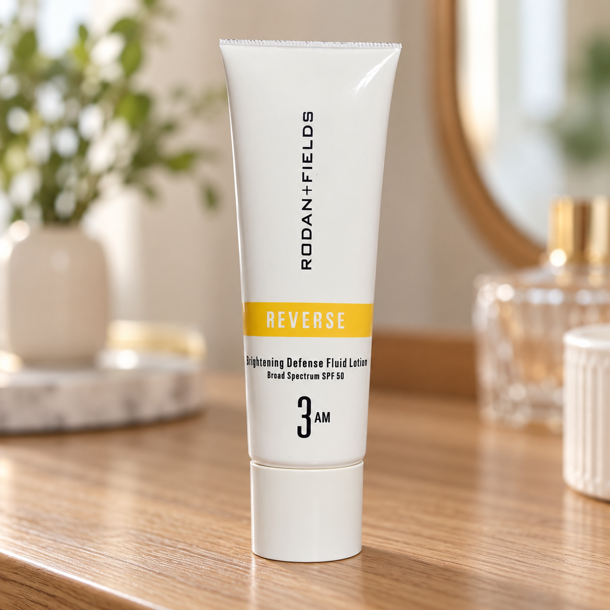 Single Rodan and Fields Reverse SPF 50 lotion tube in a vanity setting