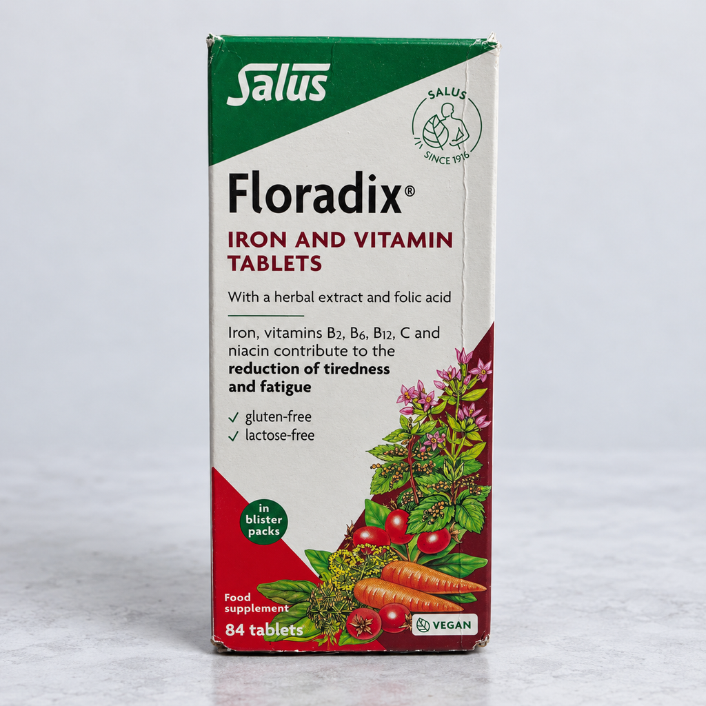 Salus Floradix Iron and Vitamin Tablets 84-count vegan box with visible carton wear on a clean square background