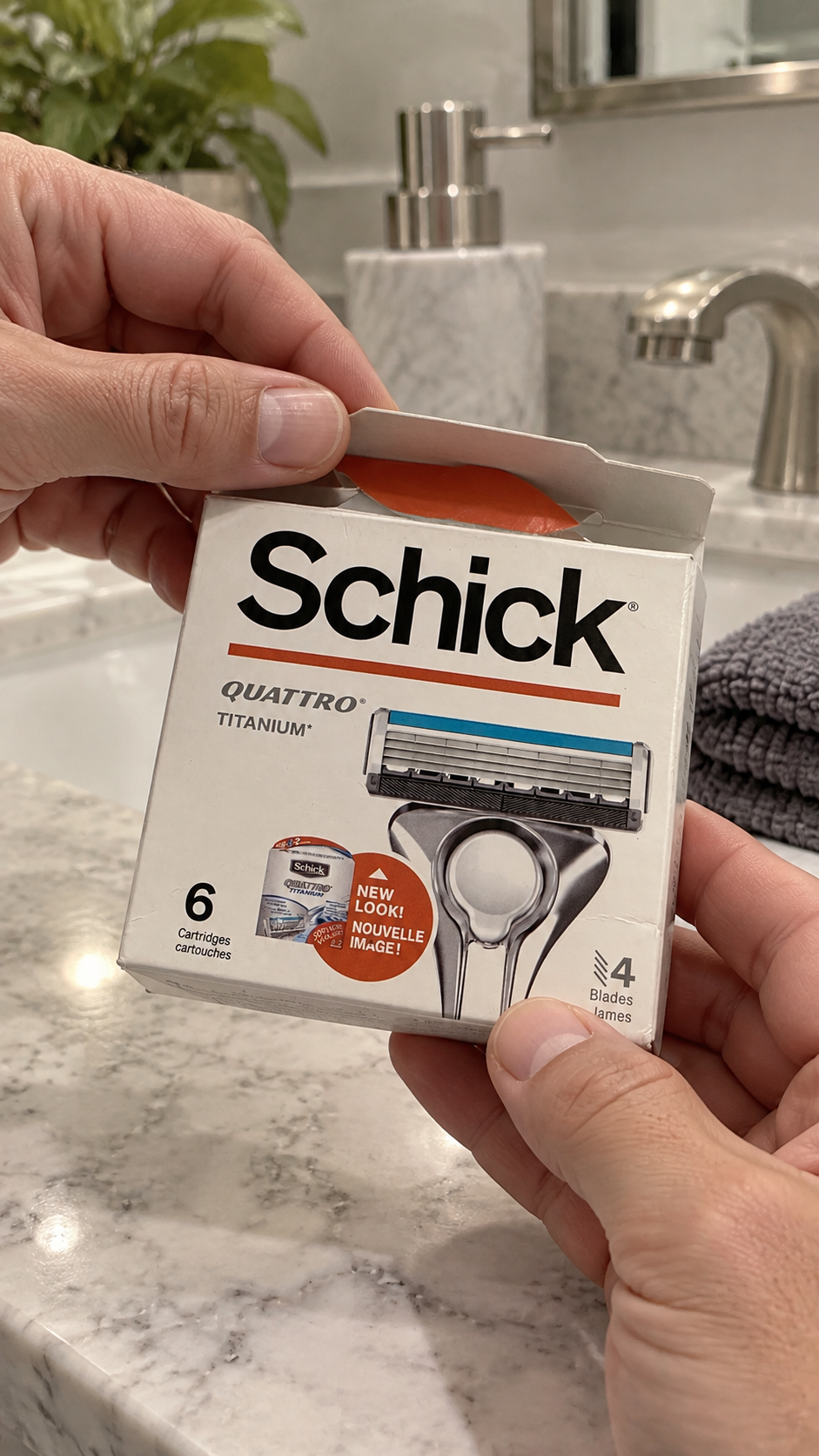 Hands opening a Schick Quattro Titanium six-cartridge refill box.