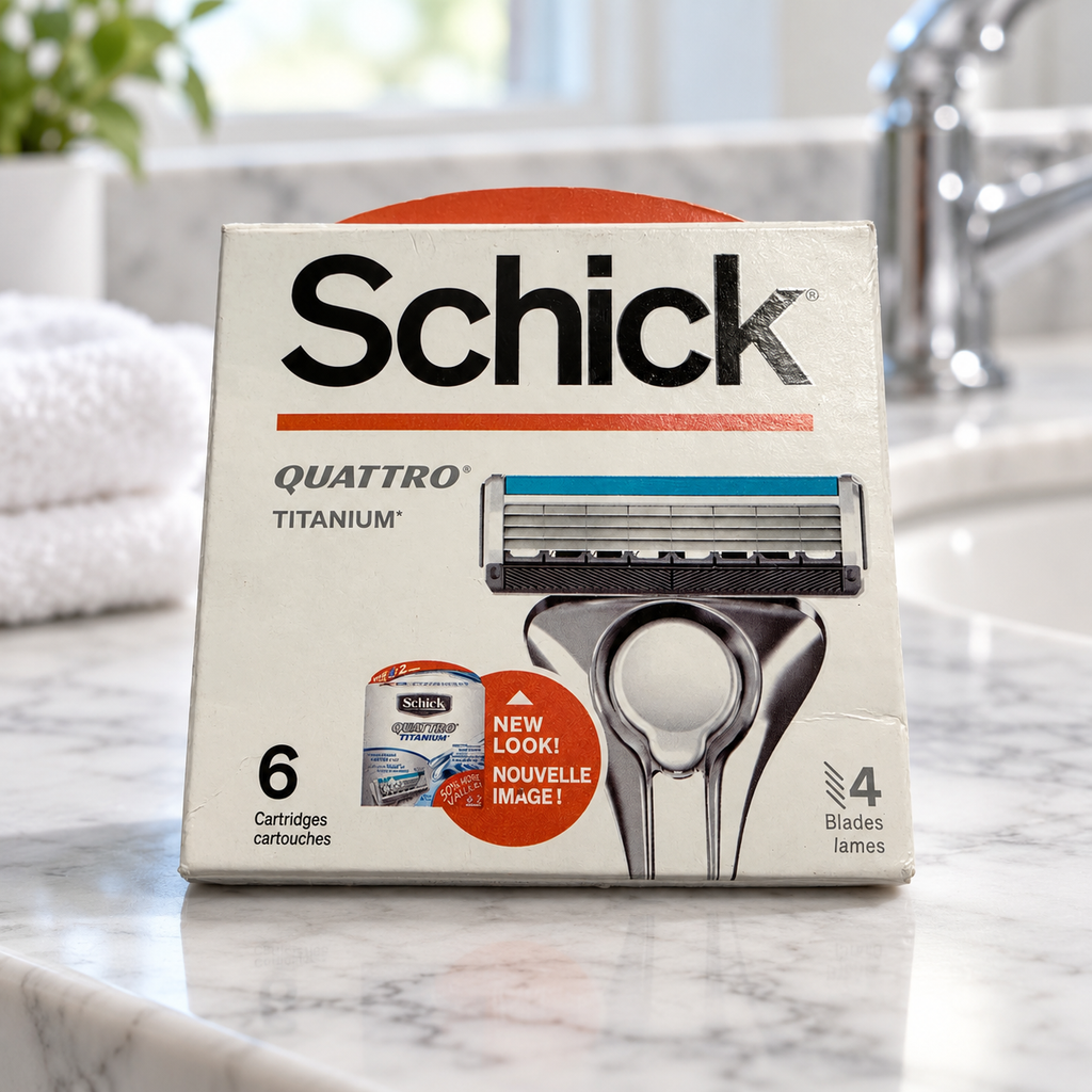 Illustrative lifestyle view of one Schick Quattro Titanium six-cartridge refill box on a marble bathroom counter