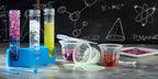 Scientific Explorer test tubes, stand, cups and tools with colorful experiment materials on a tabletop.