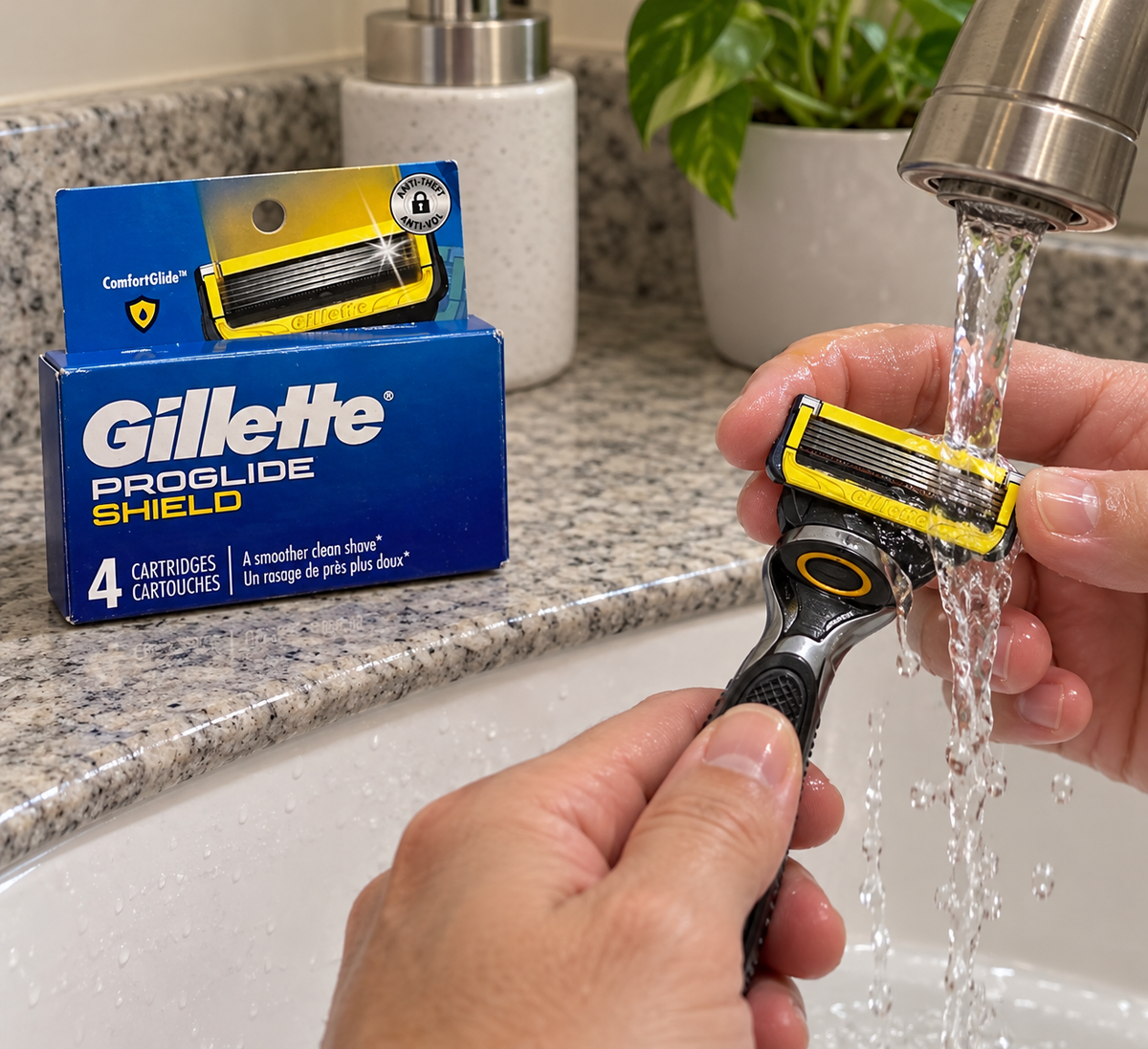 A ProGlide Shield cartridge being rinsed on a compatible handle beside a four-refill pack.
