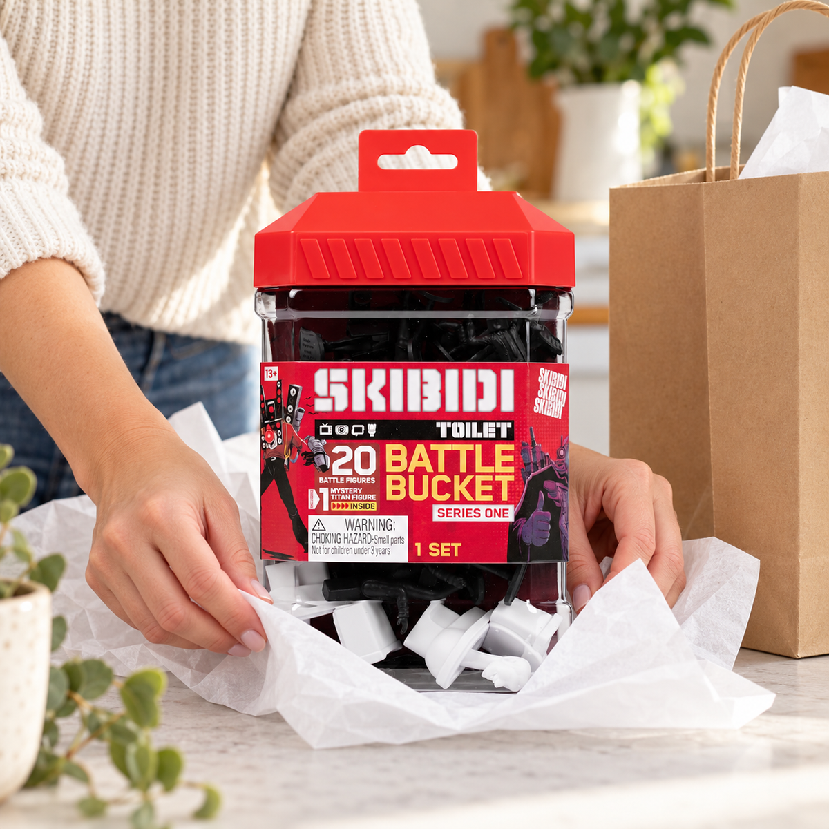 AI-staged gift preparation with the Skibidi Toilet Battle Bucket; gift bag and tissue are props