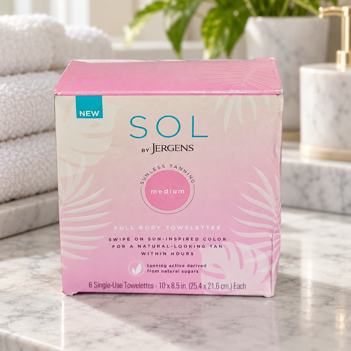 AI-generated lifestyle scene of one closed SOL by Jergens medium six-towelette box in a bathroom vanity setting. Props not included.