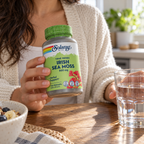 Solaray Irish Sea Moss bottle held at the breakfast table with water