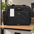 AI-generated lifestyle scene of the closed black Solo New York Ace briefcase with orange accents in an office shelf setting. Props not included; tag shown from reverse.