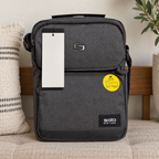 AI-generated lifestyle scene of the closed gray Solo New York Ludlow tablet sling on an entry bench. Props not included; hangtag shown from reverse.