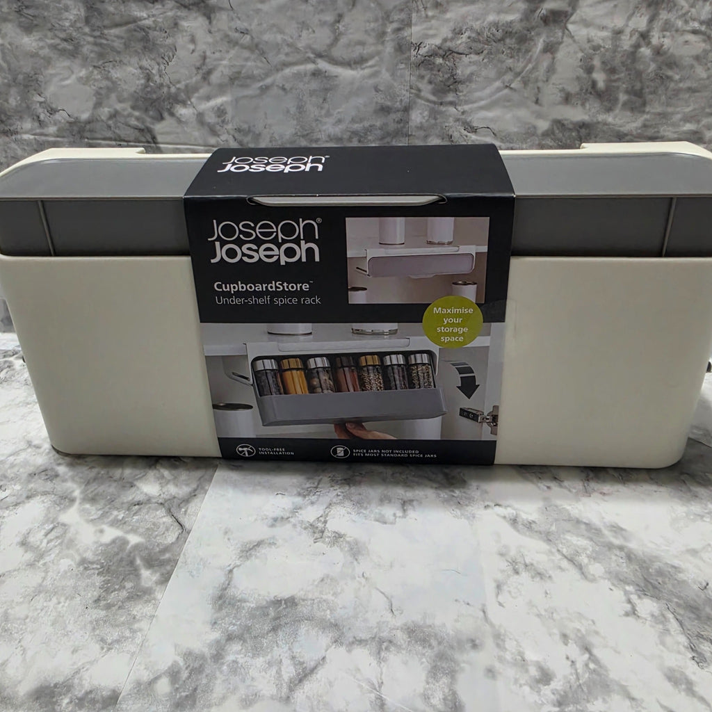 Joseph Joseph CupboardStore grey under-shelf spice rack in original sleeve packaging; jars not included