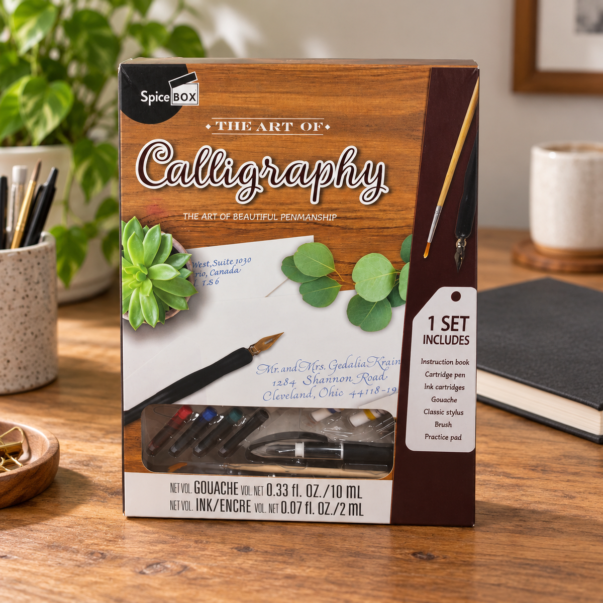 AI-generated lifestyle scene of one closed SpiceBox The Art of Calligraphy kit in a craft desk setting. Background props not included.