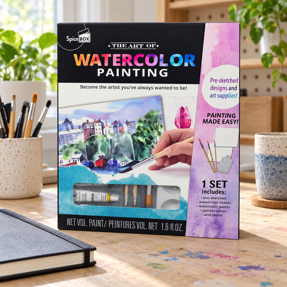 AI-generated lifestyle scene of one closed SpiceBox The Art of Watercolor Painting kit in a craft desk setting. Background props not included.