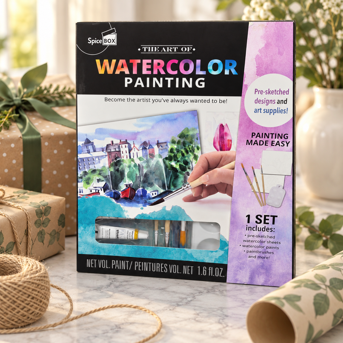 AI-generated lifestyle scene of one closed SpiceBox The Art of Watercolor Painting kit in a gift table setting. Background props not included.