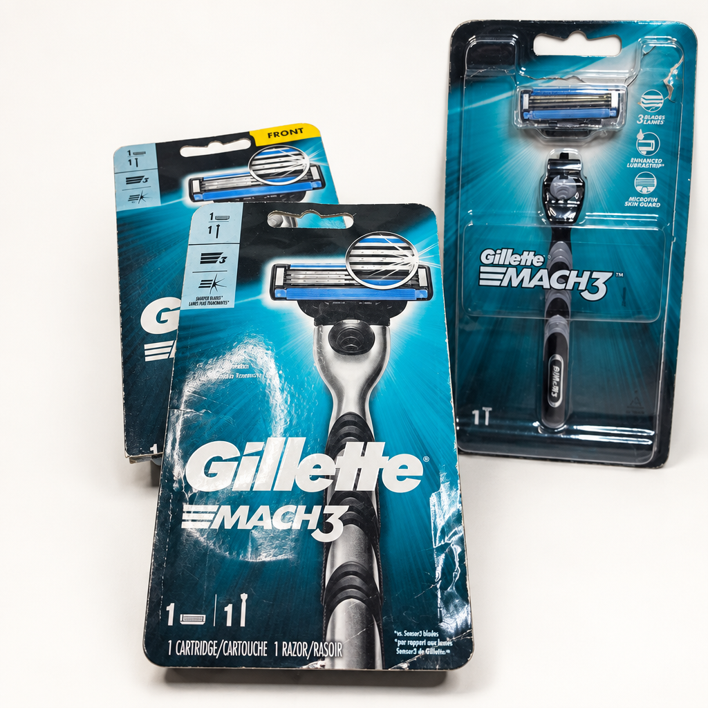 Three Gillette MACH3 Original retail razor packs on a white surface, each with one handle and one cartridge