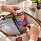 Adult packing SUKU Kids Multi bottle upright in a travel tote