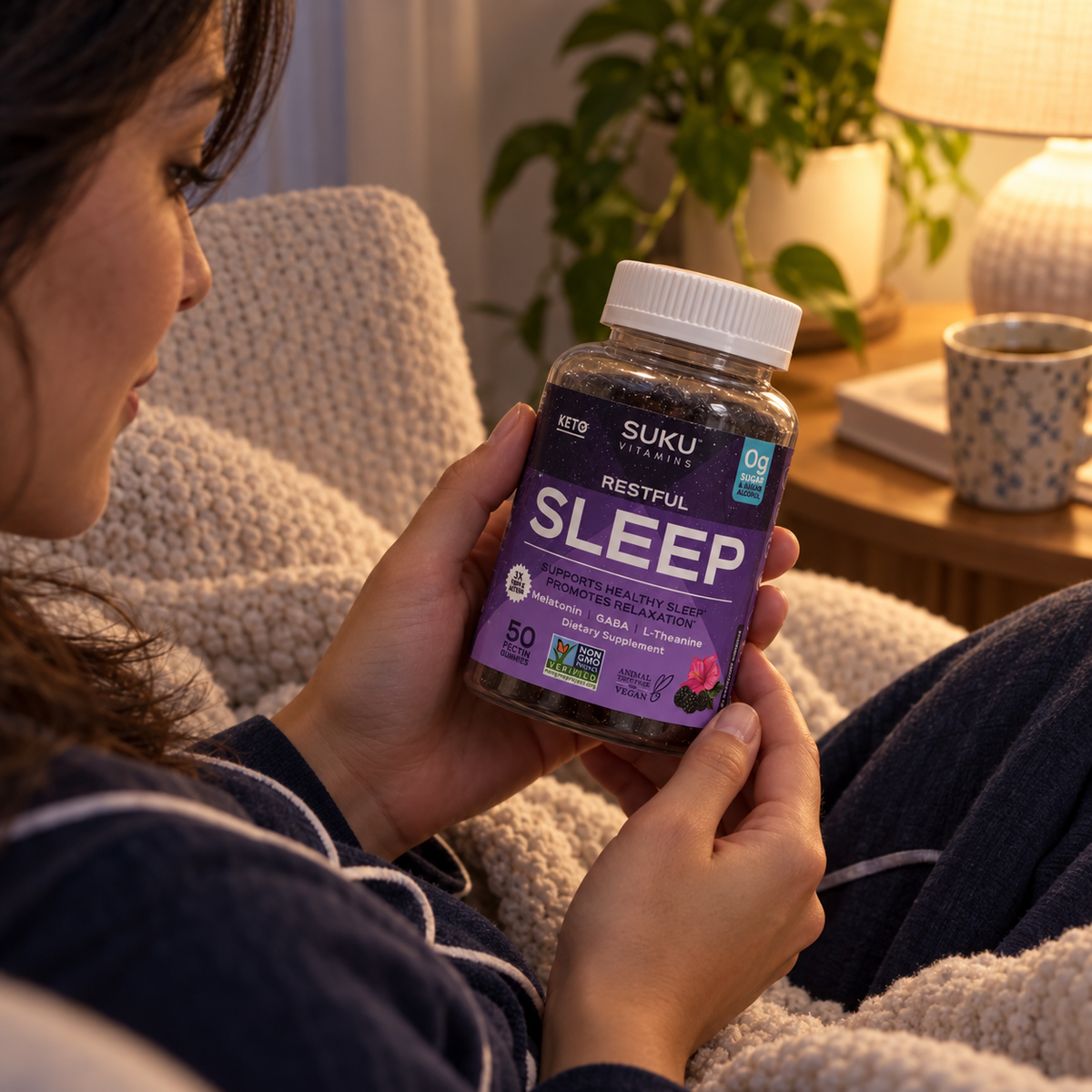 Adult reviewing SUKU Restful Sleep during an evening routine