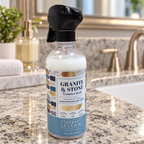 AI-generated lifestyle scene of one Therapy Clean Granite & Stone Garden Verbena 16 fl oz trigger bottle in a bath vanity setting. Props not included.
