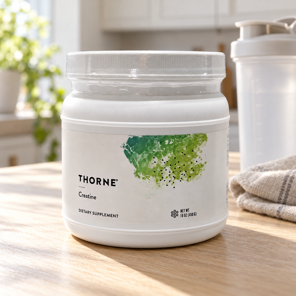 Illustrative lifestyle scene of Thorne Creatine 450 g on a kitchen counter beside an unbranded shaker