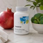 Illustrative lifestyle image of Thorne Hormone Advantage with pomegranate and broccoli